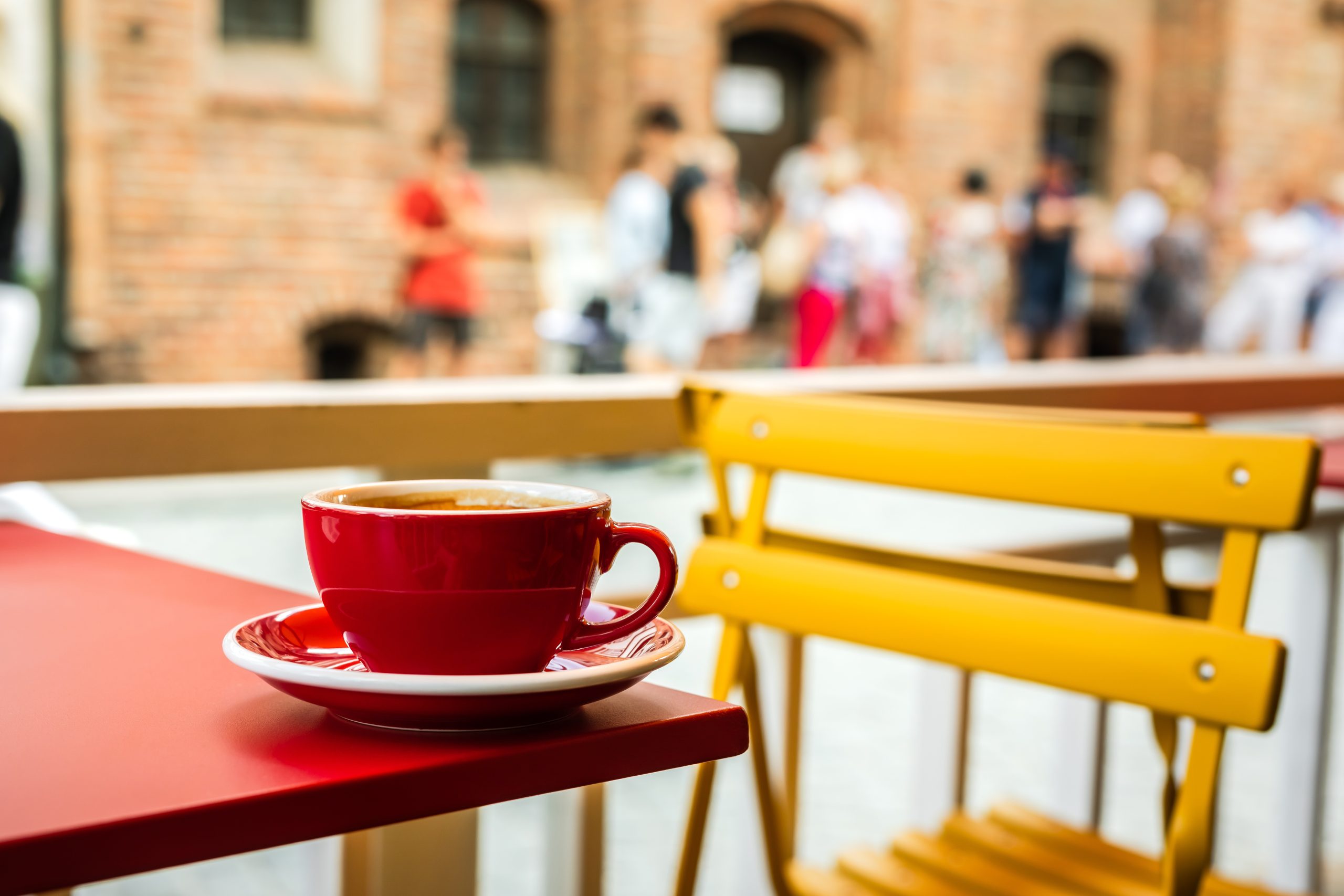 a red cup of black coffee on a cafe terrace 2025 01 09 22 17 54 utc scaled