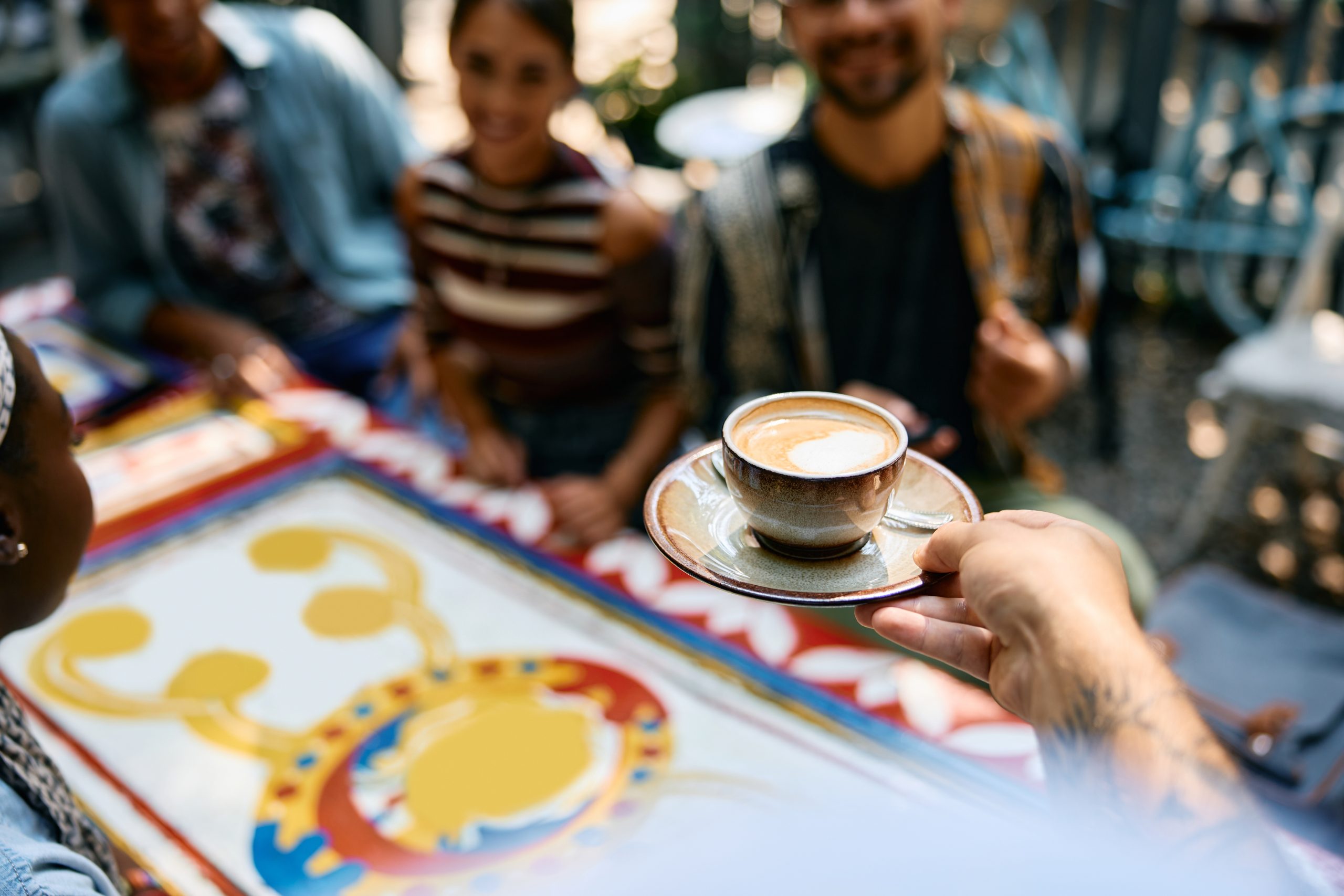 The Social Experience: Coffee Culture in Chains vs Independent Cafés 6 close up of waiter serving coffee in a cafe 2024 12 13 18 33 48 utc scaled