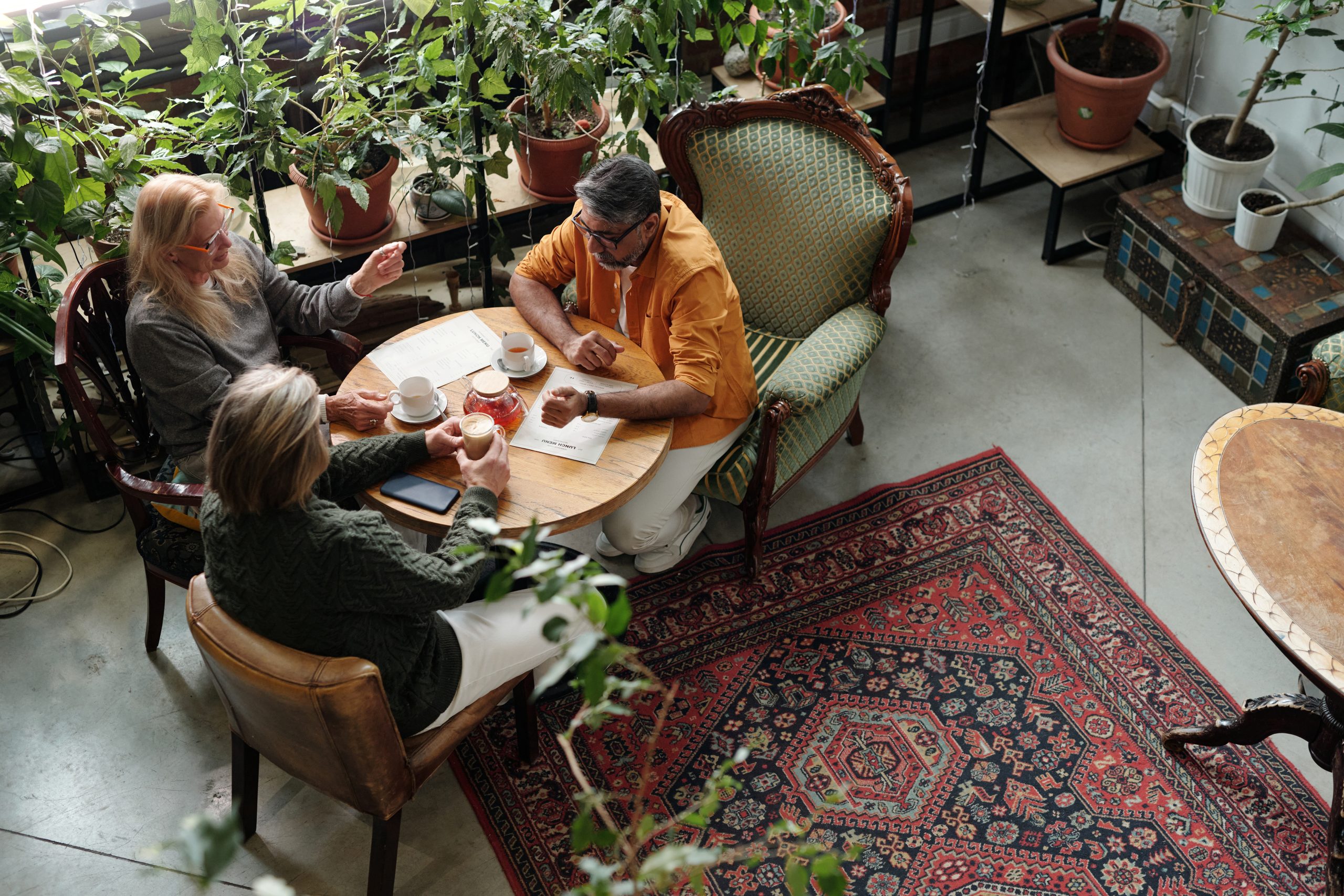 discussing over coffee at cozy cafe surrounded by 2025 06 10 15 30 35 utc scaled