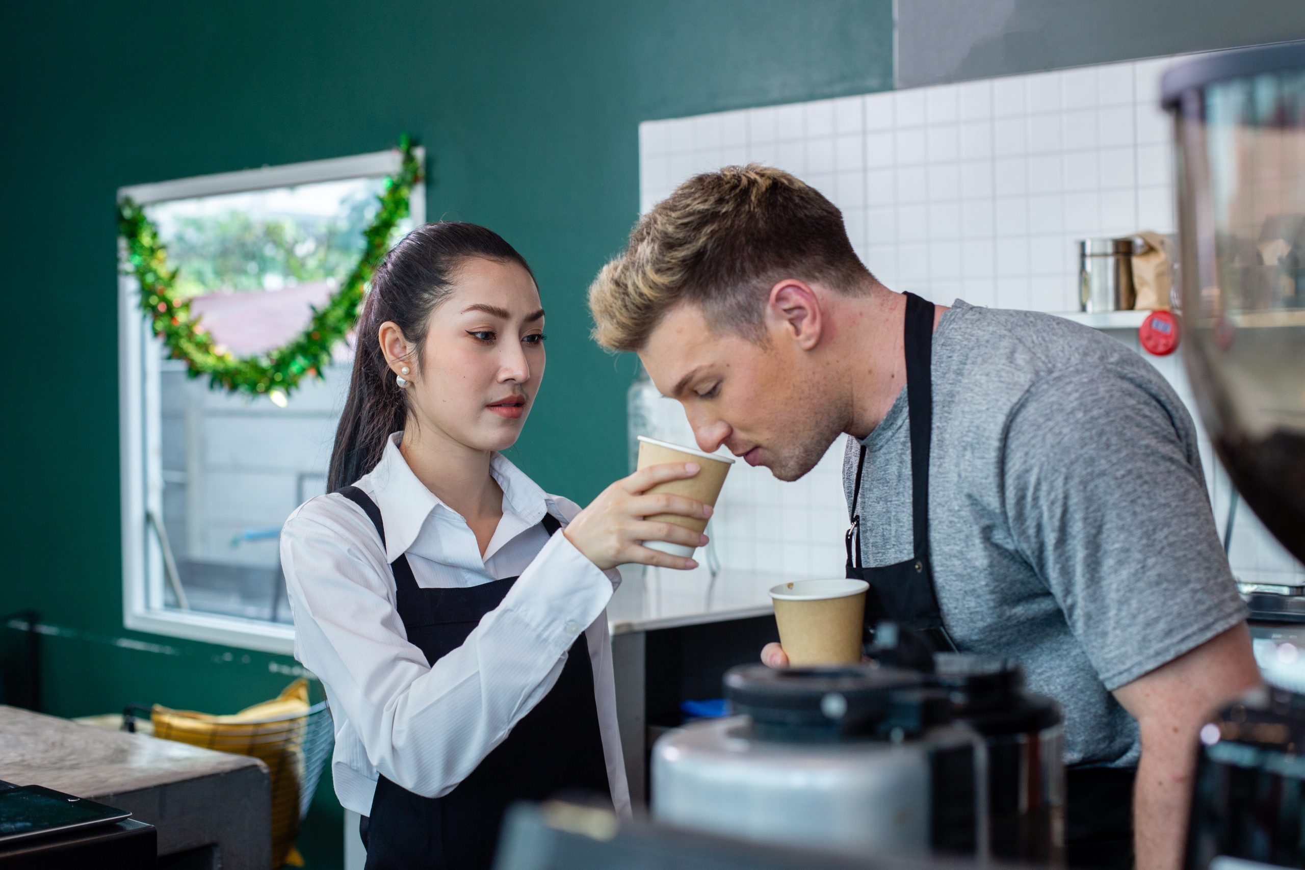 barista wearing apron talking test new flavour cof 2025 03 06 07 07 39 utc scaled