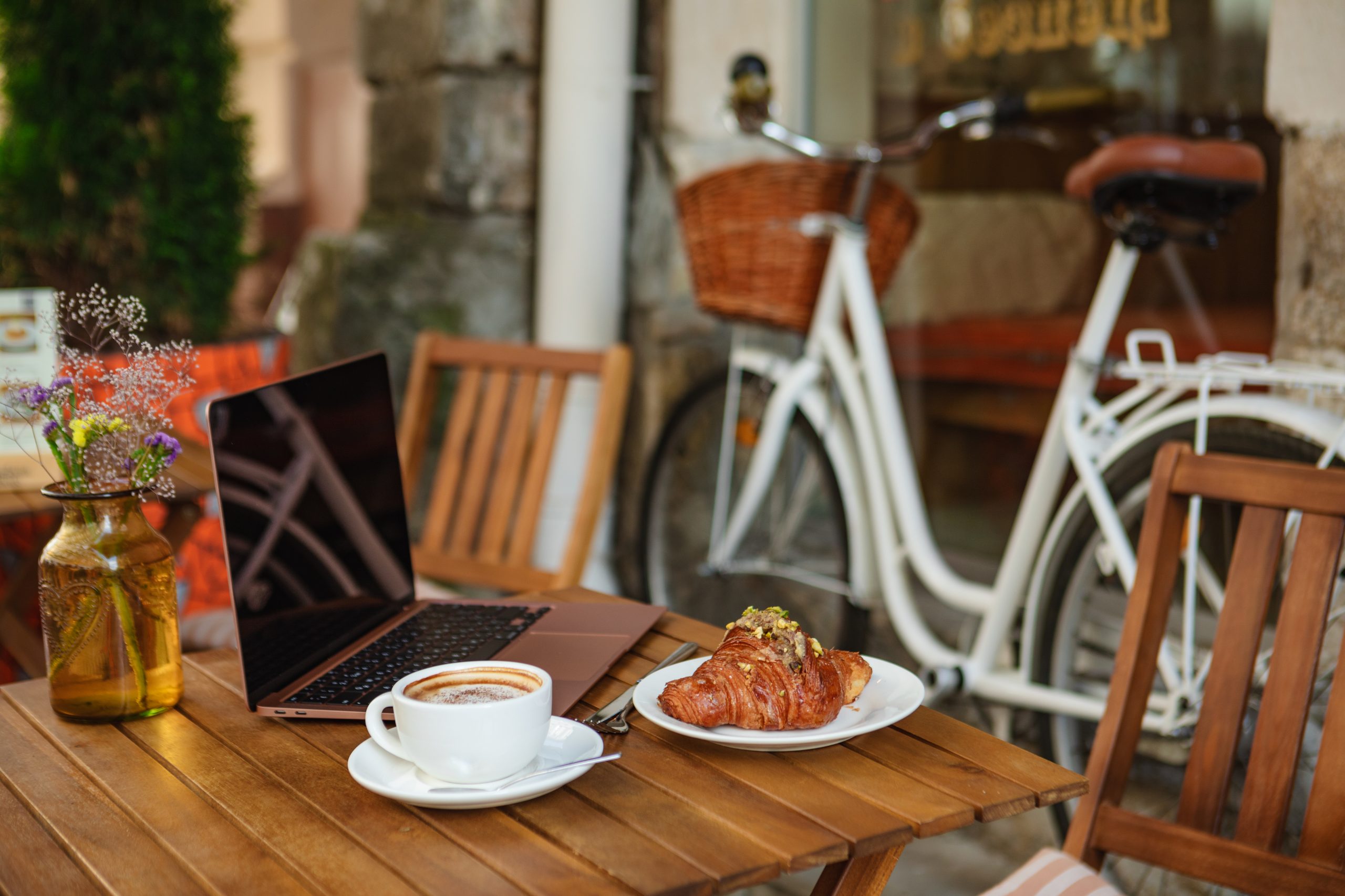 on the summer terrace of a cafe a laptop and a cr 2025 03 08 22 13 25 utc scaled