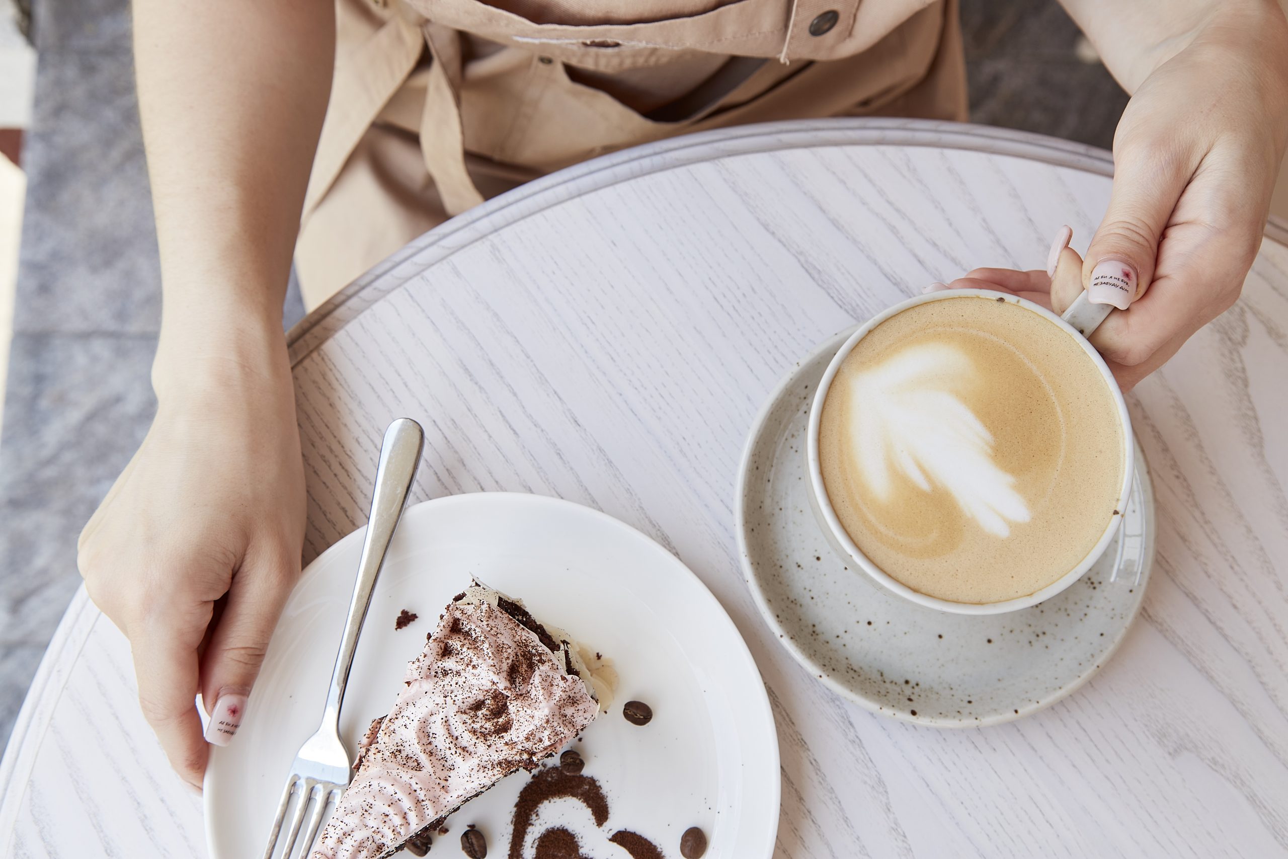 woman hands holding fruit chocolate cup of cappucc 2025 03 08 22 13 34 utc scaled
